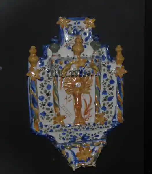 Ceramic panels of religious theme, sun on a pillar, cross